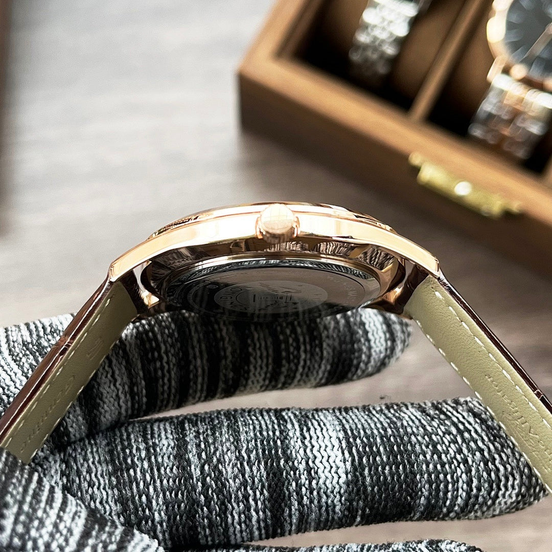 Longines watch side with crown on light leather strap