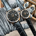 Pair of Longines quartz watches, black dials, black leather straps, gold-tone bezel