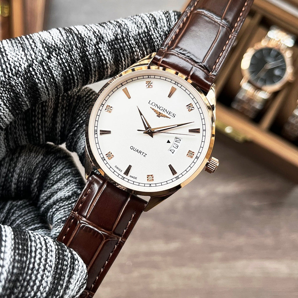 Longines quartz watch with white dial and brown leather strap on knit cuff