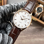 Longines quartz watch with white dial and brown leather strap on knit cuff