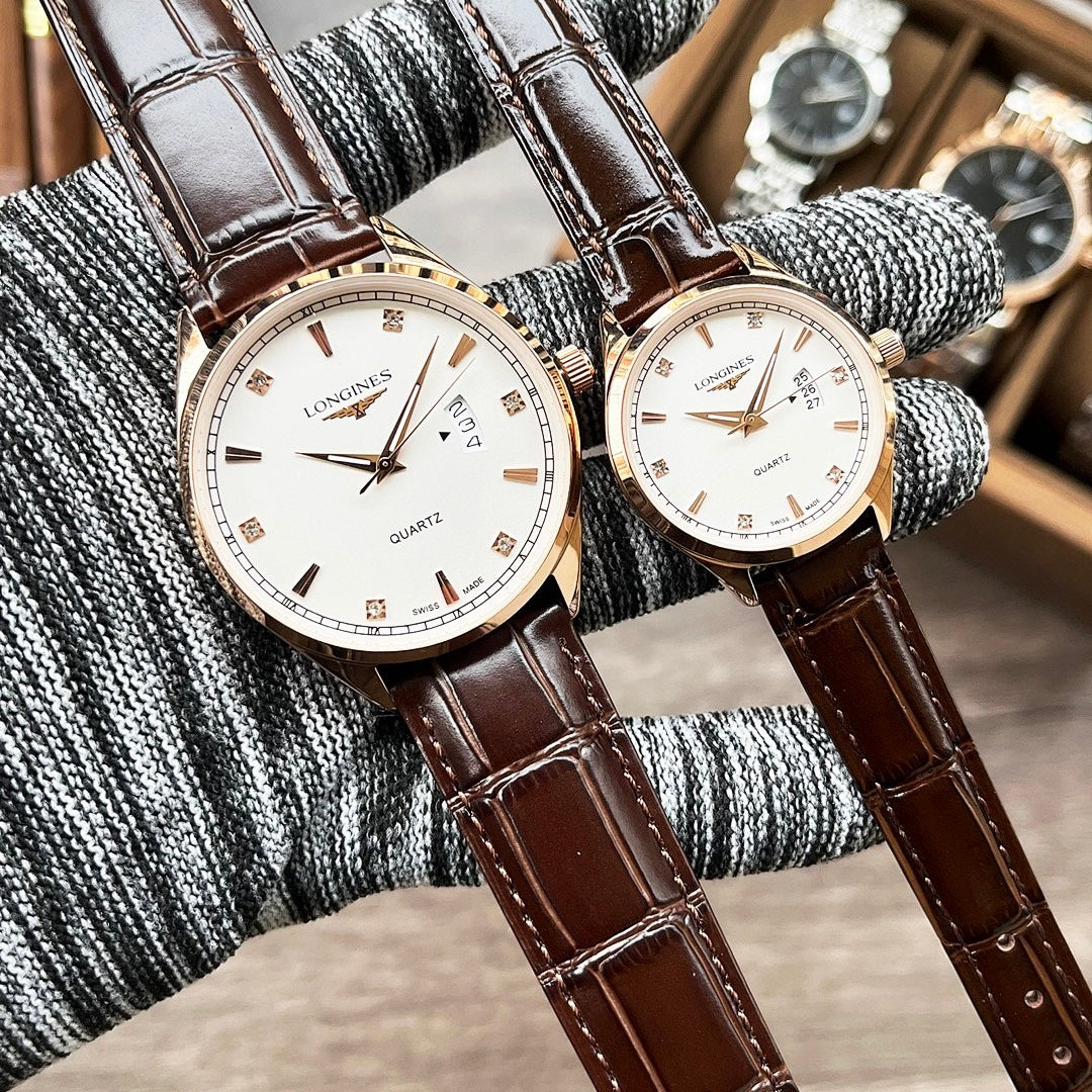 Pair of Longines quartz watches with white dials and brown leather straps
