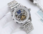 Longines watch with silver tone bracelet and round silver skeleton dial with blue moon detail