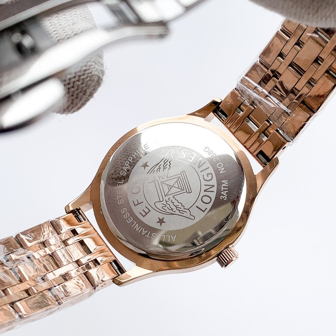 Longines watch case back on rose-gold metal bracelet, engraved emblem and text
