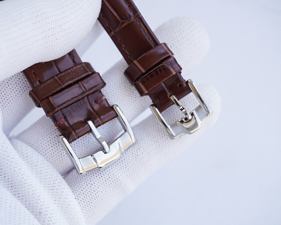 Longines watch straps with brown croc-style leather and silver buckles