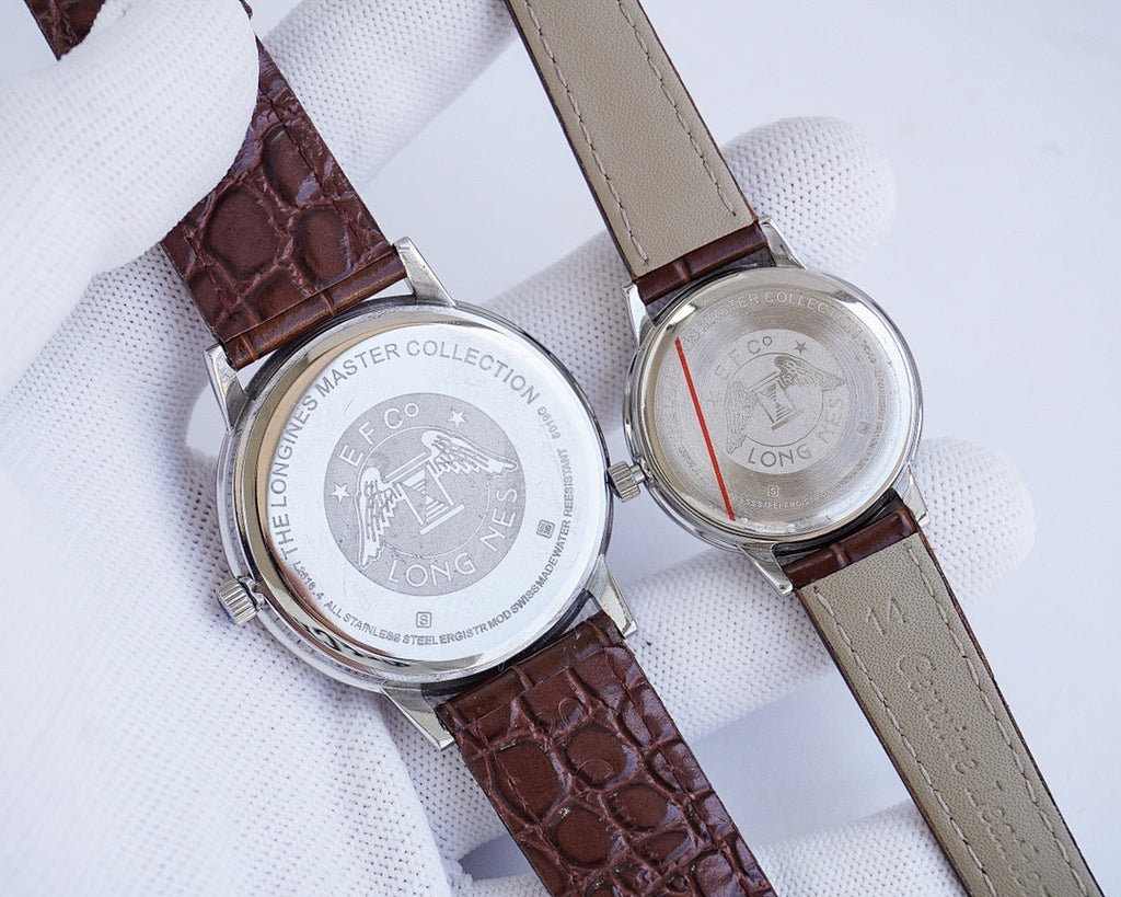 Longines watch pair, stainless steel casebacks on brown and light leather straps