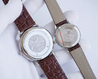 Longines watch pair, stainless steel casebacks on brown and light leather straps