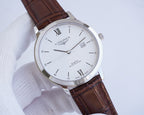 Longines watch with white dial, Roman numerals, and brown leather strap