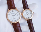 Longines watch pair with white dial, Roman numerals, and dark brown leather straps