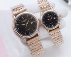Longines quartz watches with black dials and rose-gold tone metal bracelets, two-pack