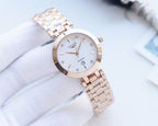 Longines round watch with white dial and rose-gold bezel on metal bracelet