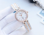 Longines round watch with crystal bezel, white dial, and silver metal bracelet