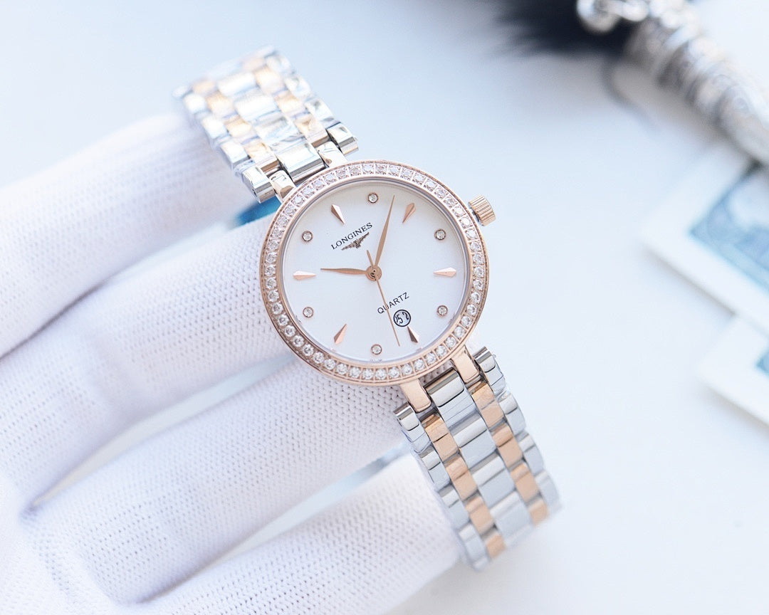 Longines round watch with crystal bezel, white dial, and silver metal bracelet