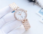 Longines round watch with white dial, crystal bezel, and two-tone metal bracelet