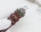 Brown crocodile-style leather strap wristwatch with stainless clasp and engraved logo