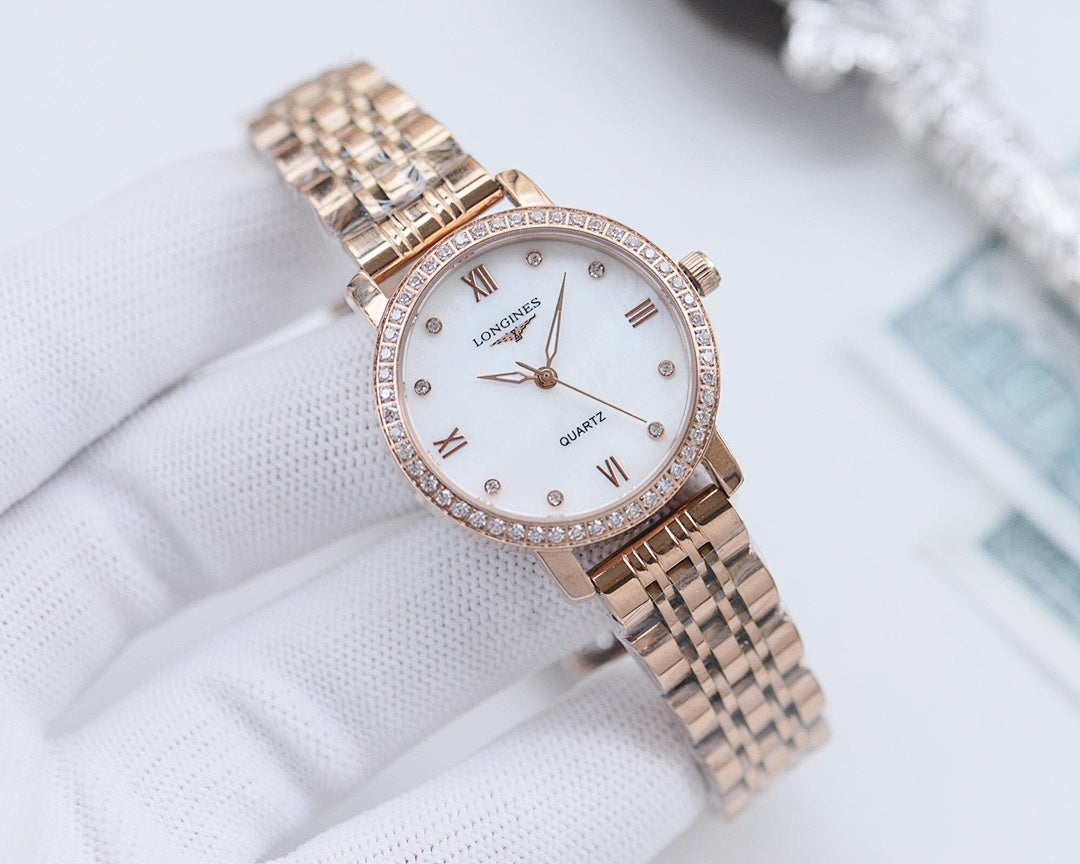 Longines watch with rose-tone metal bracelet, white dial, and crystal-studded bezel