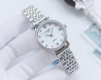Longines watch with silver bracelet, white dial, Roman numerals, crystal-studded bezel