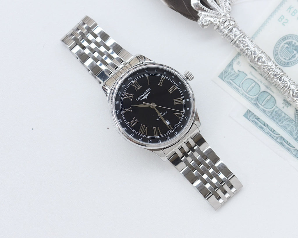 Longines watch with black dial and Roman numerals, stainless steel bracelet