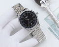 Longines watch with black dial, Roman numerals, stainless steel bracelet