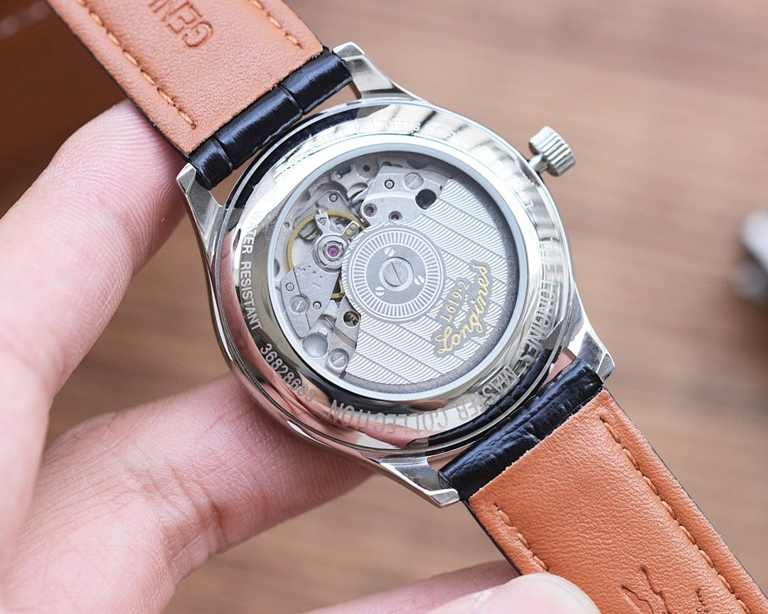 Longines automatic watch caseback with visible mechanism and black leather strap