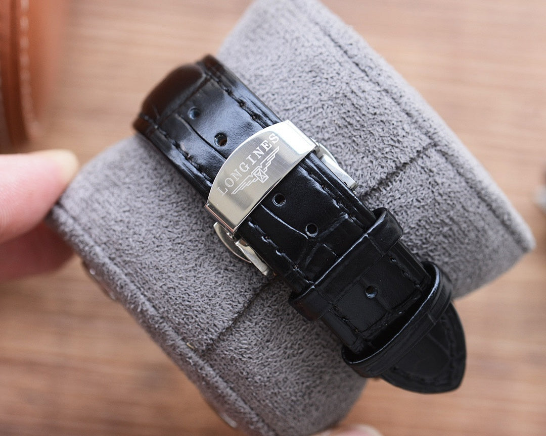 Longines automatic watch with black leather strap and silver buckle clasp