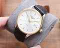 Longines automatic watch with white dial, gold-tone case, and black leather strap