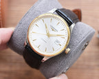 Longines automatic watch with white dial, gold-tone case, and black leather strap