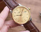 Longines automatic watch with gold-tone dial, gold-tone case, and brown leather strap