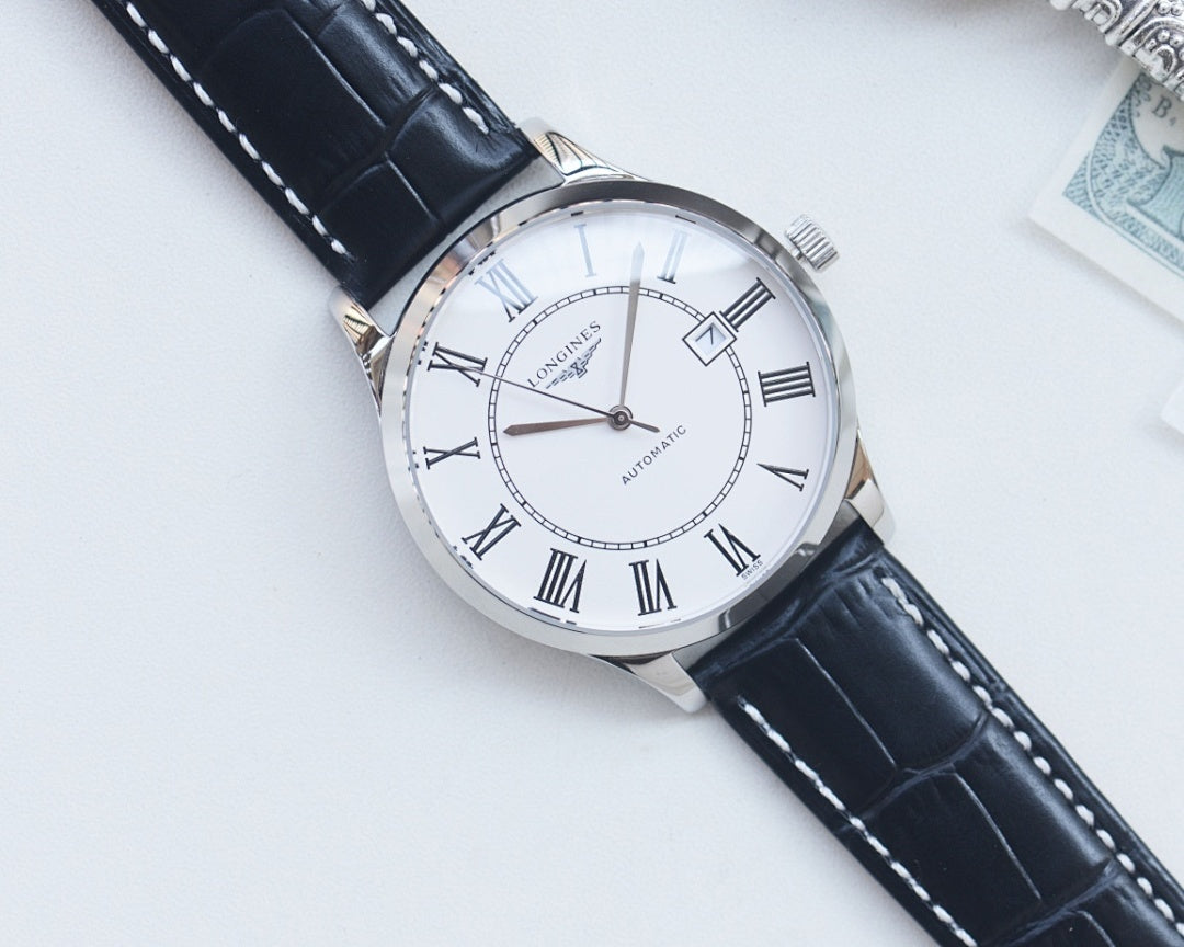 Longines automatic wristwatch with white dial, Roman numerals, silver case, dark leather strap