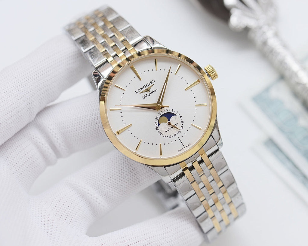 Two-tone wristwatch with champagne dial, gold accents and silver link bracelet.