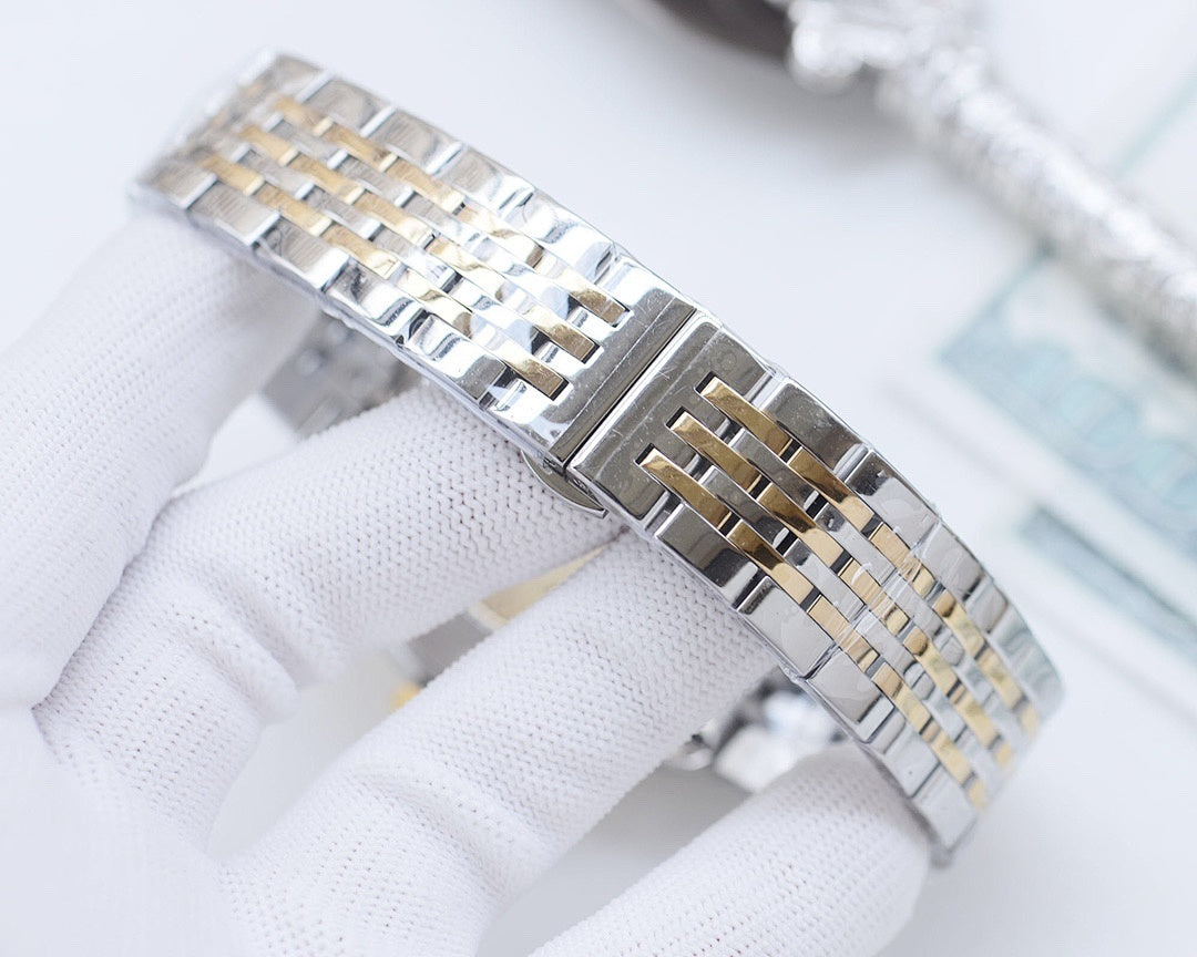 Two-tone wristwatch bracelet with alternating silver and gold-tone links.