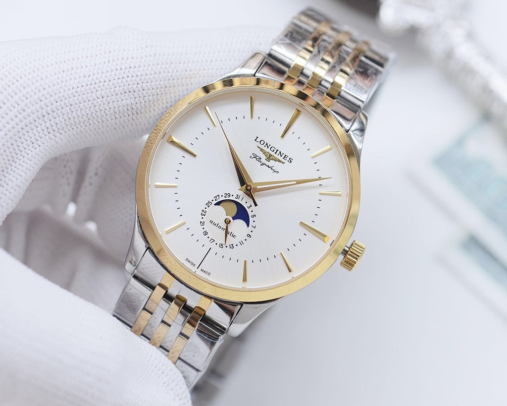 Two-tone wristwatch with champagne dial and silver-and-gold link bracelet.