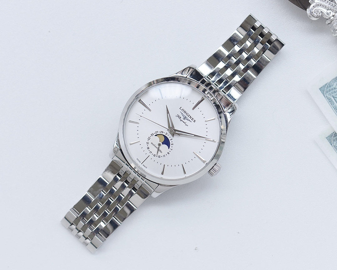 Wristwatch with white dial and silver link bracelet, angled view.