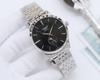 Wristwatch with black dial and silver link bracelet, gold-tone accents.