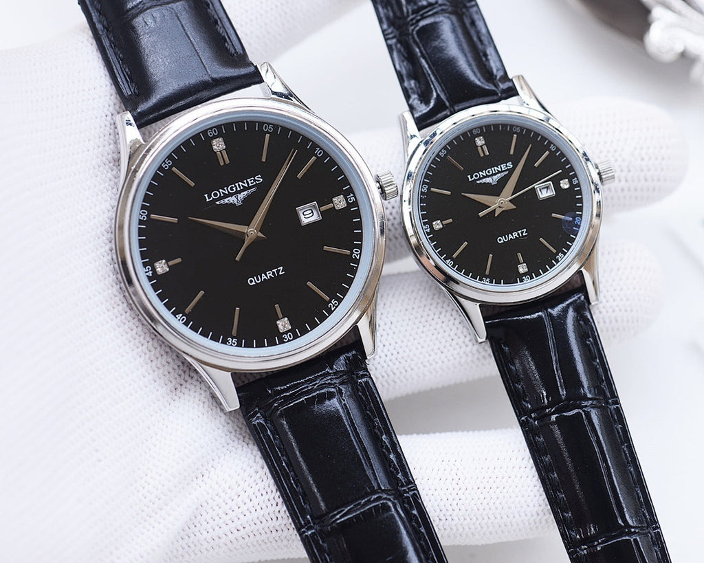 Longines quartz watch pair with black dials and navy leather straps, silver tone cases