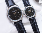 Longines quartz watch pair with black dials and navy leather straps, silver tone cases