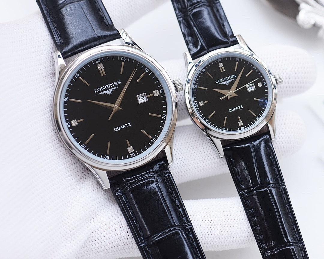 Longines quartz watch pair with black dials and navy leather straps, silver tone cases