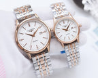Longines quartz watch pair with silver bracelet, white dial, gold-tone cases, date window