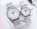 Longines quartz watch with silver metal bracelet and white dial, two watches shown