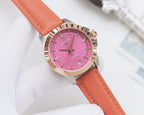 Round wristwatch with pink dial and orange leather strap, silver bezel