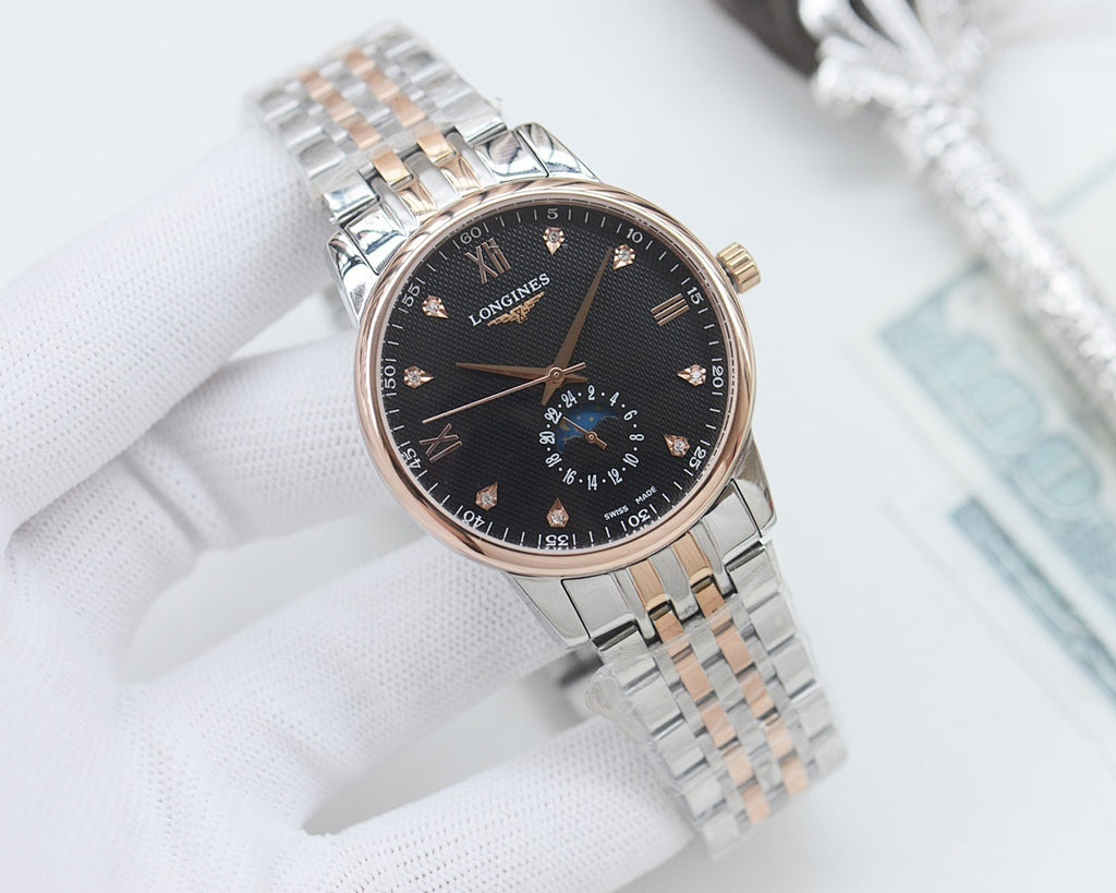 Longines watch with dark dial, gold-accent hands, and stainless steel link bracelet