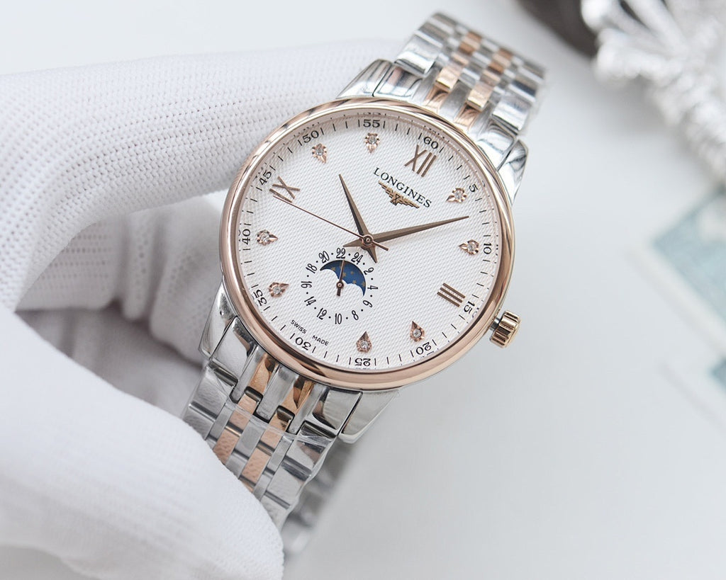 Longines watch with light dial, subdial at center, and stainless steel link bracelet