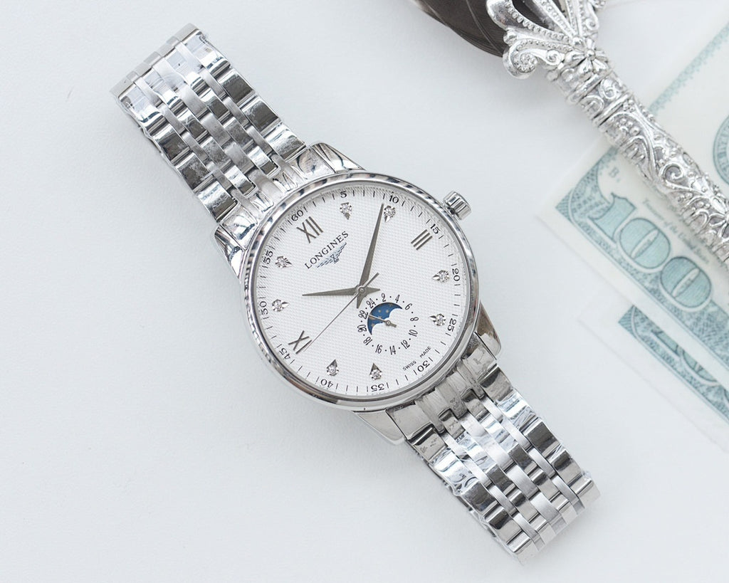 Longines watch with white dial, blue moonphase subdial, and stainless steel link bracelet