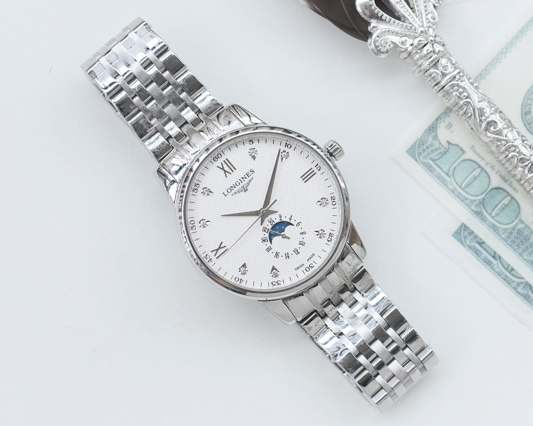 Longines watch with white dial, blue moonphase subdial, and stainless steel link bracelet