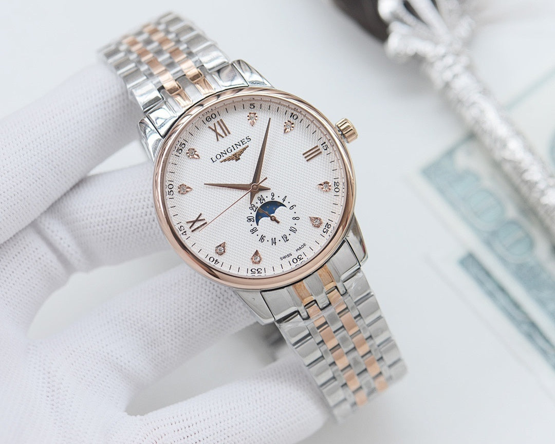 Longines watch with light dial, gold-tone accents, and stainless steel link bracelet