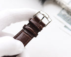 Longines watch strap with brown leather and silver buckle hardware