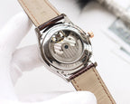 Longines wristwatch with visible mechanical caseback, brown leather strap