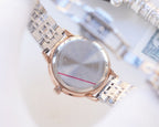 Longines watch with rose-gold case and two-tone metal bracelet; white dial, slim bezel