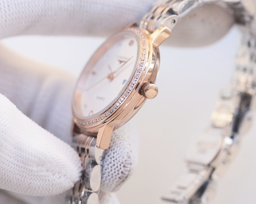 Longines watch with rose-gold case and two-tone bracelet; white dial with crystal bezel