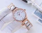 Longines watch with rose-gold bezel and two-tone metal bracelet; white dial with minute markers