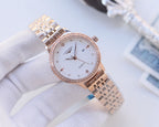 Longines watch with rose-gold bezel and two-tone metal bracelet; white dial, quartz hands